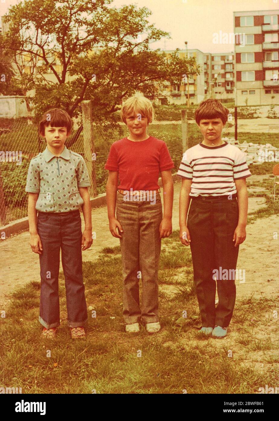 THE CZECHOSLOVAK SOCIALIST REPUBLIC - CIRCA 1980s: Retro photo shows pupils (boys) outdoors. They pose for a group photography. Color photo. Stock Photo