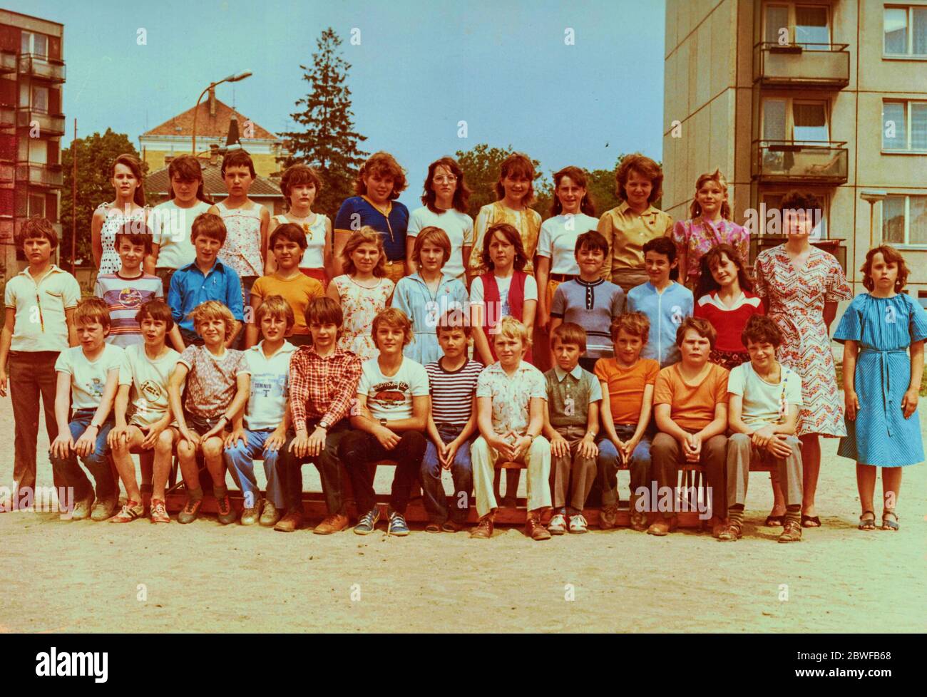 THE CZECHOSLOVAK SOCIALIST REPUBLIC - CIRCA 1980s: Retro photo of group of school pupils (teenagers) with their female teacher. Stock Photo