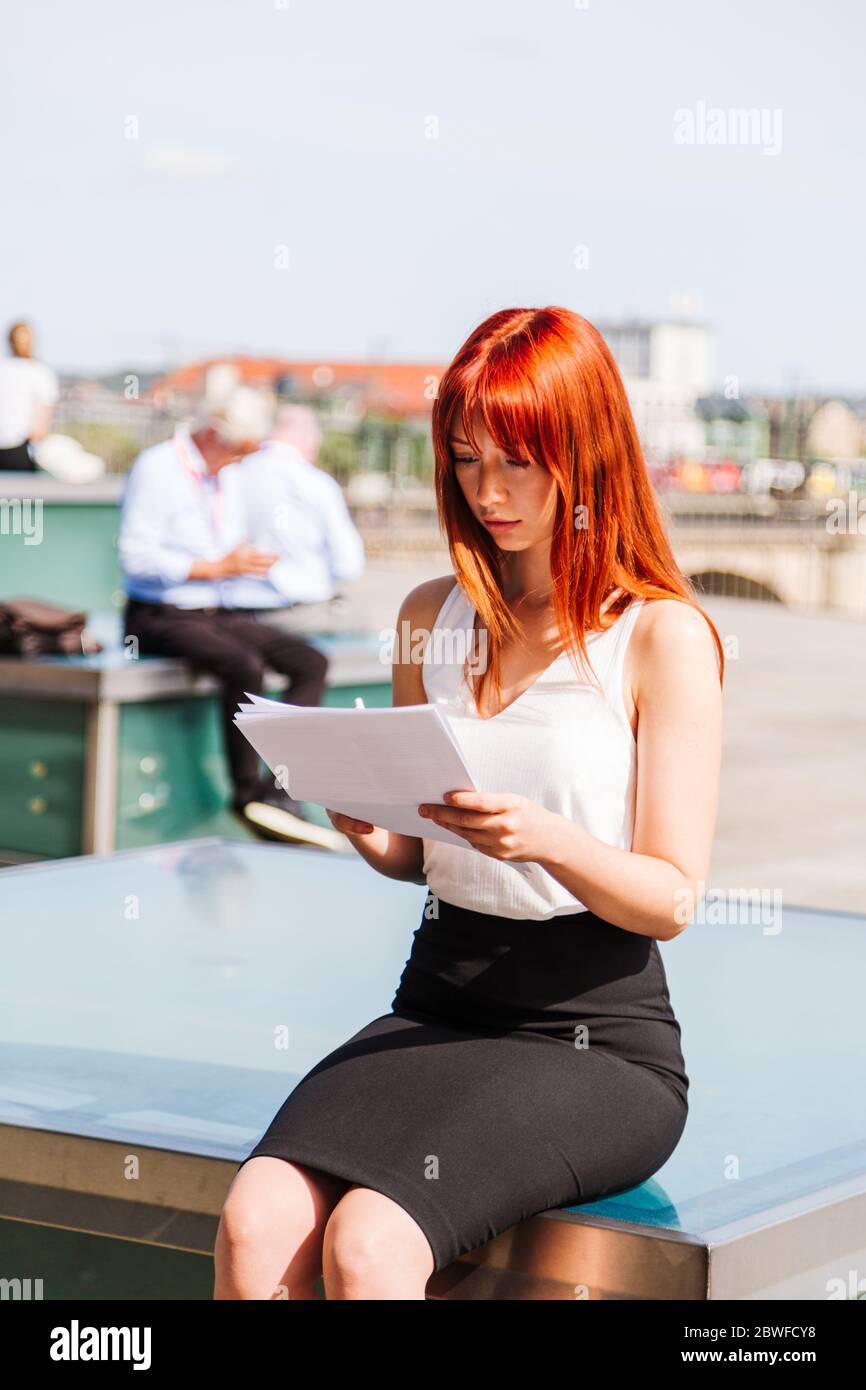 Young redhead business woman in formal outside Stock Photo - Alamy