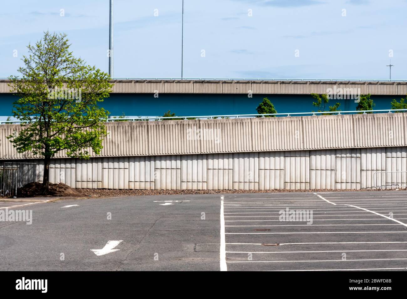An empty car park with a motorway in the background in Glasgow, Scotland Stock Photo