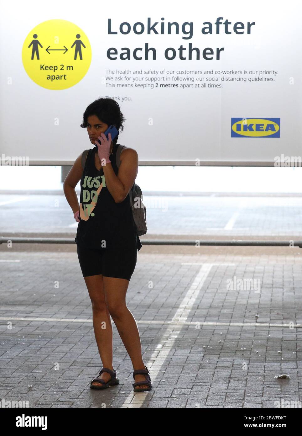 Customers queuing at the IKEA Tottenham store in Edmonton, north London, as it reopens to the