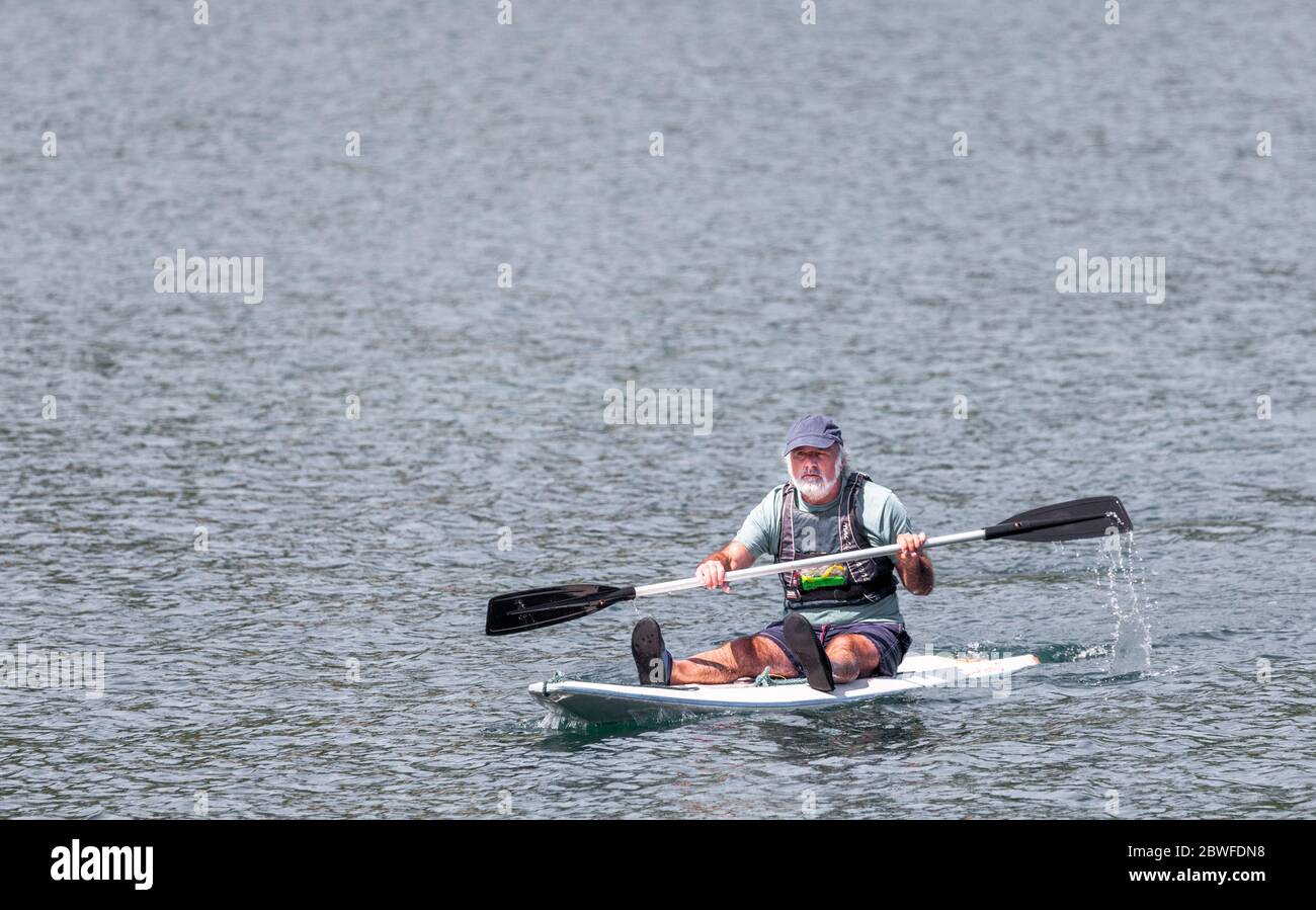Crosshaven, Cork, Ireland. 01st June, 2020. Robbie Parker returning to Crosshaven after paddle boarding around Spike Island and Houlbowline on a glorious bank holiday Monday. - Credit; David Creedon / Alamy Live News Stock Photo
