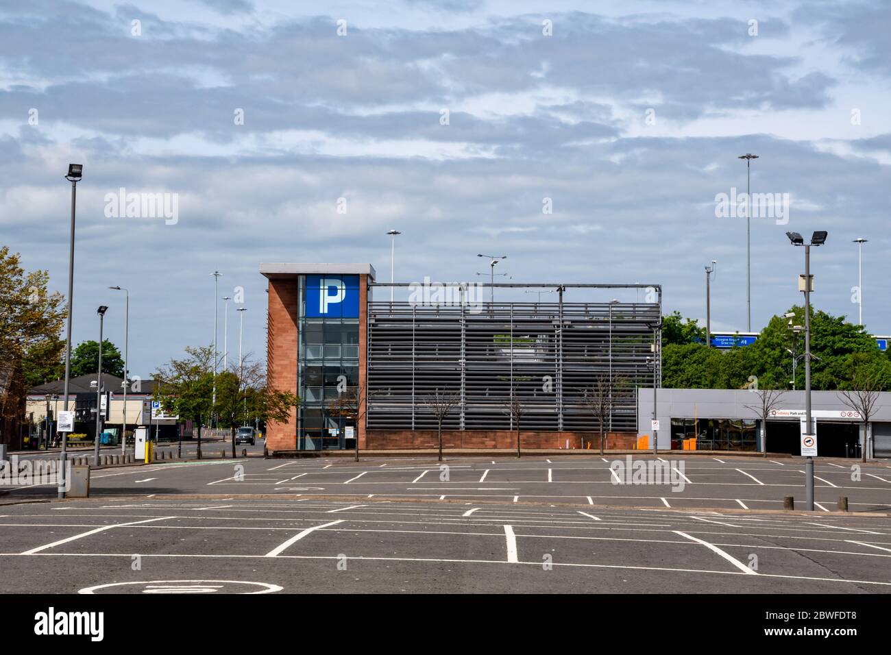 Empty outdoor and indoor multi-storey car parks at Shields Road subway station in Glasgow, Scotland. Stock Photo