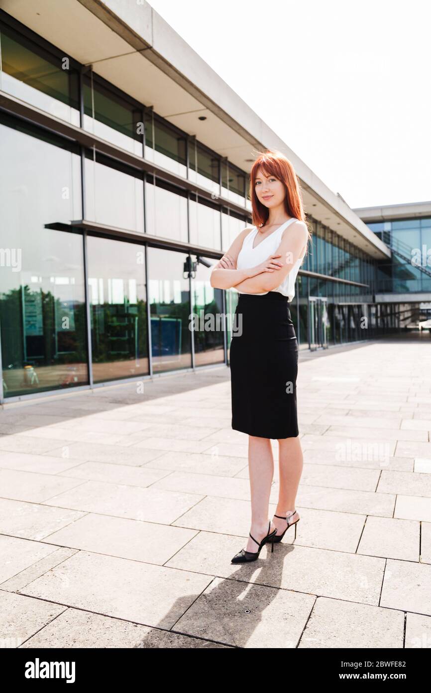 Young redhead business woman in formal outside Stock Photo - Alamy
