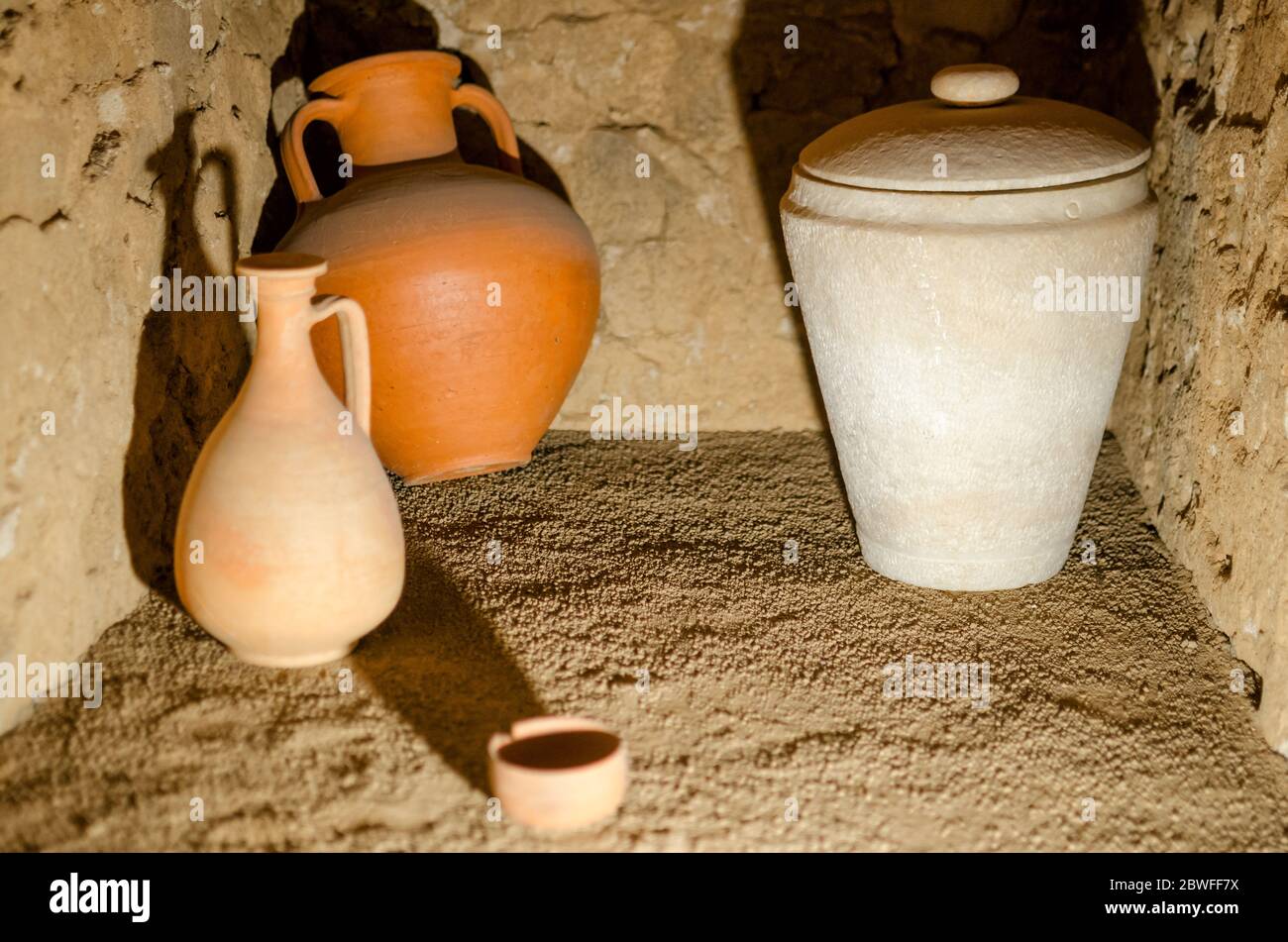 Ancient roman pottery in an antique tomb Stock Photo