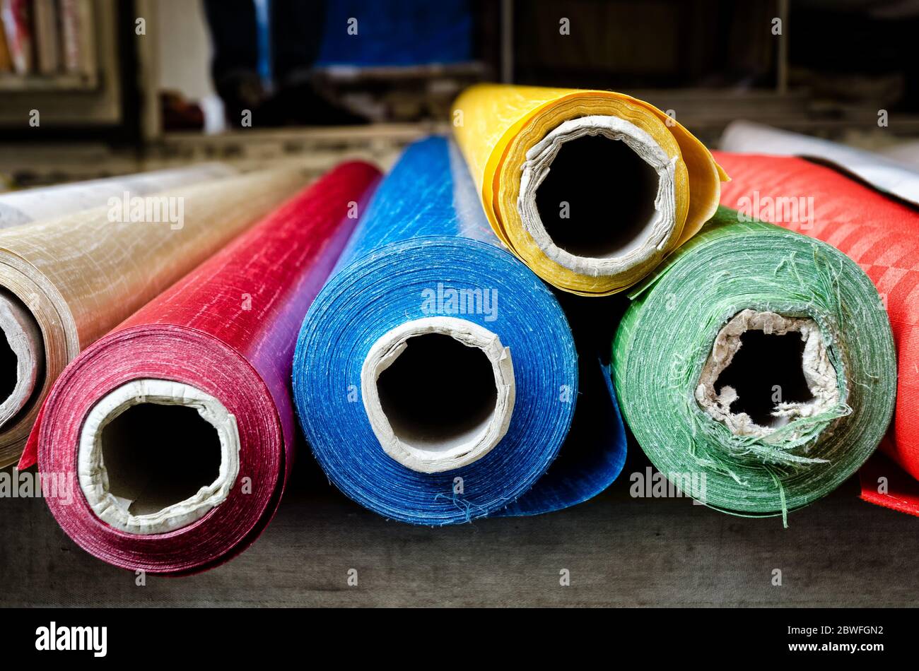 Rolls of cloth on the stall of a street market Stock Photo