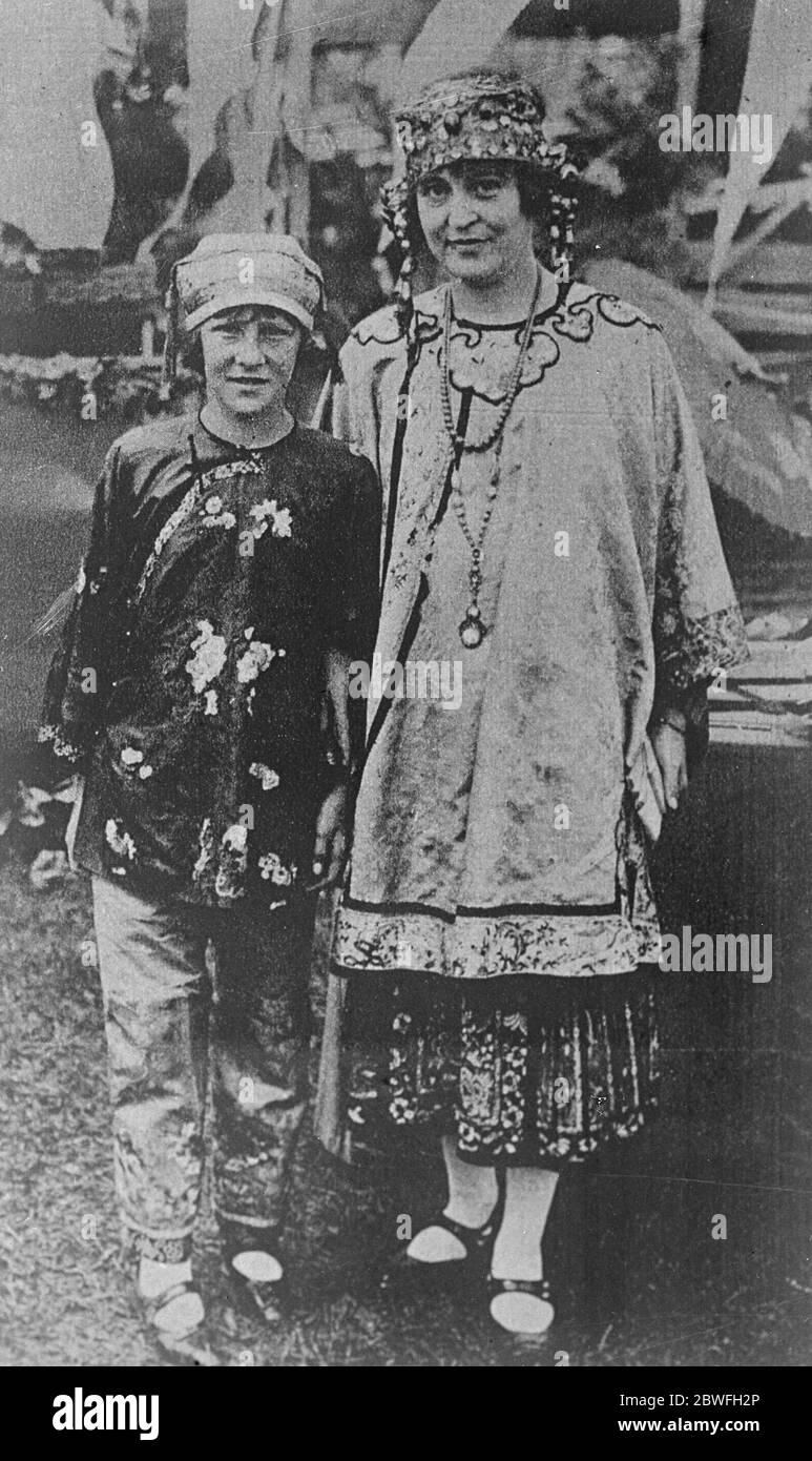 Millionairess and her unconventional attire Mrs August Belmont Jnr with her daughter Alice photgraphed in Chinese costume during a recent society fair at Bayshore Long Island 21 December 1922 Stock Photo