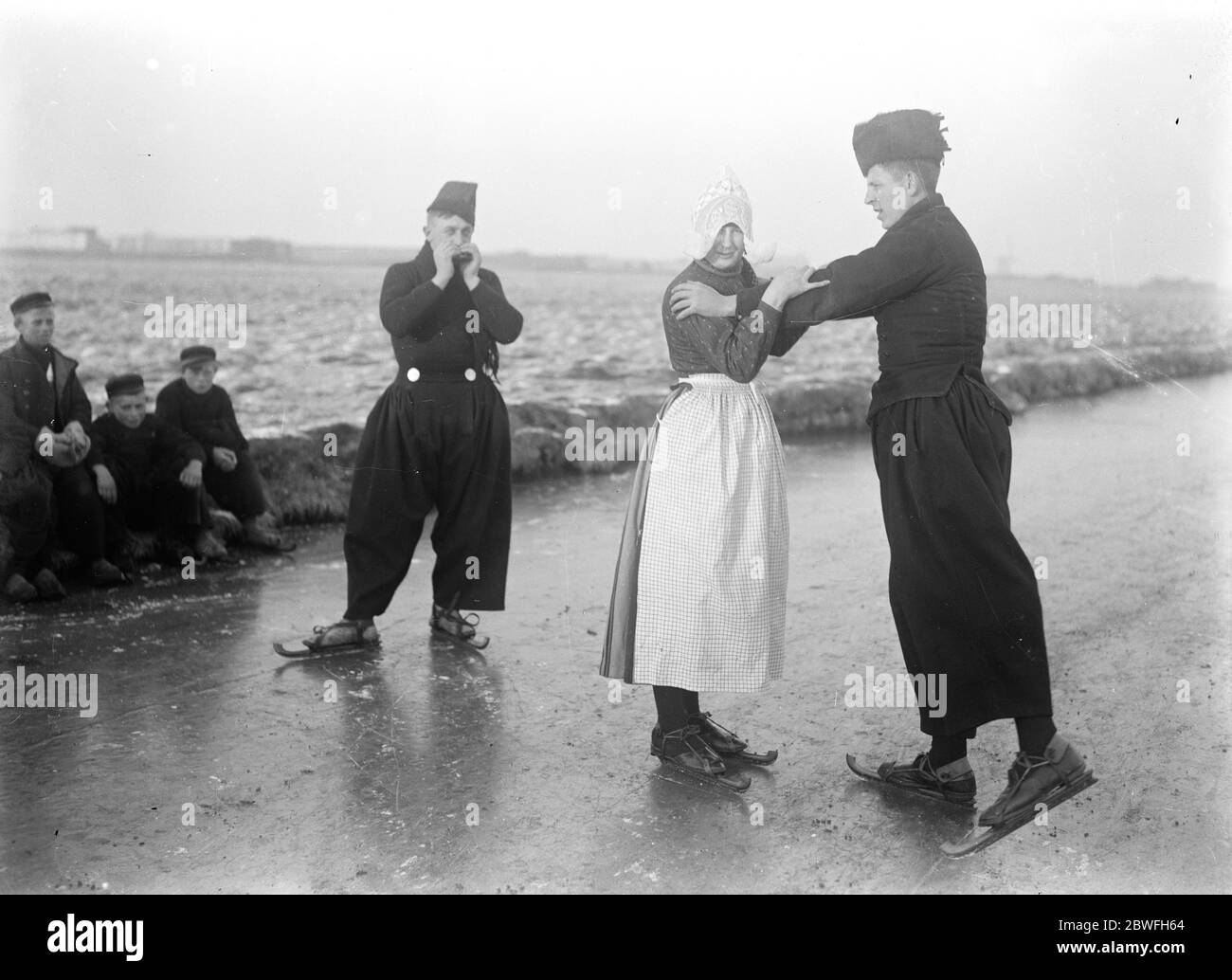 Holland Ice Bound Telegrams from Holland state a hard frost and fierce cold prevail and all canals frozen Waltzing on the ice in Holland ' s latest craze . This snapshot shows a waltz in progress to mouth organ accompaniments 10 December 1921 Stock Photo