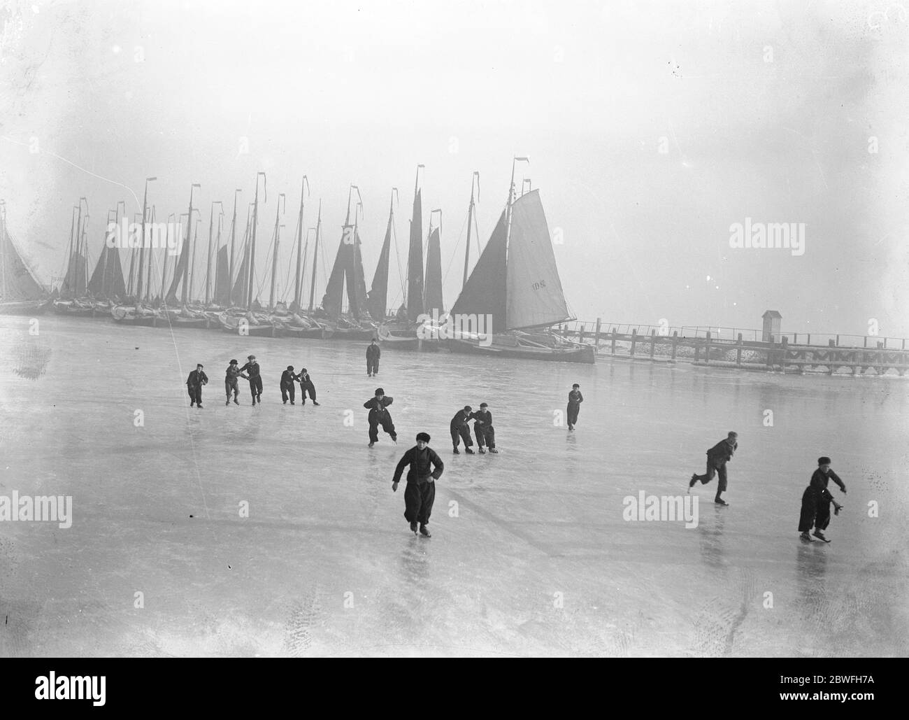 Everybody Skating in Holland Skating has been general in Holland during this weekend . Hand in hand the Dutch folk have glided over the ice to their hearts content 4 December 1921 Stock Photo