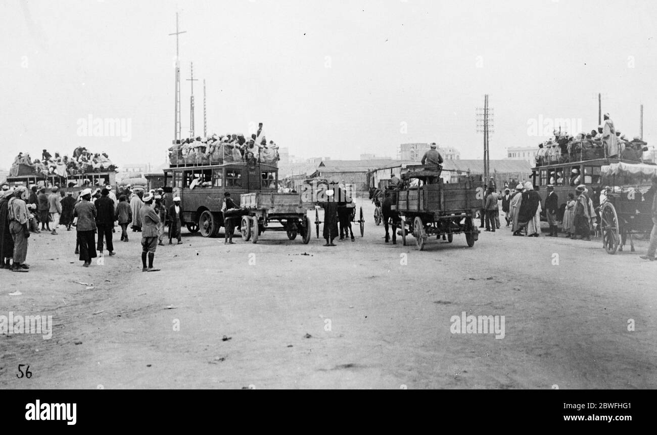 The ubiquitous motor bus . From Casablanca , Morocco , showing desert motor buses crowded with natives on the point of departure for distant towns and villages in the interior . In many cases the route is across the Sahara . 5 March 1924 Stock Photo