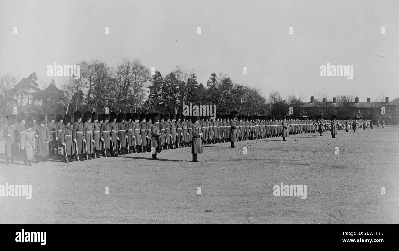 Welsh Guards Cheer the Prince With bearskins held aloft at the point of their bayonets , the 1st Welsh Guards gave ringing cheers for the Prince of Wales when he inspected them . 1 March 1924 Stock Photo
