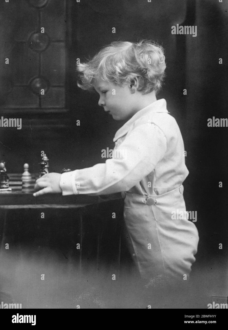 A budding Capablanca Little Prince Michael of Romania , the oly son of the Crown Prince , photographed recently in Venice , while playing chess . 26 November 1924 Stock Photo