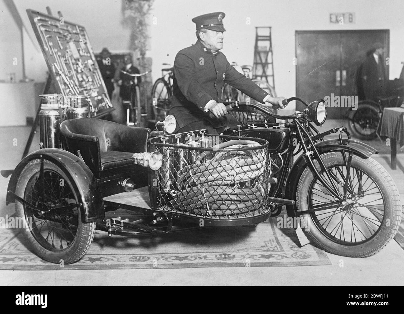 Fire fighting motor cycle A motor cycle equipped with fire fighting apparatus suitable for a small town or extensive estate . This machine was on view at the New York motor show 1 February 1926 Stock Photo