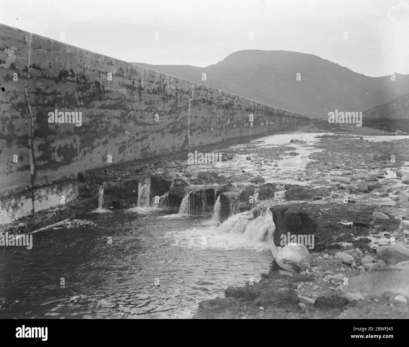 The Welsh disaster . At the inquest on the victims of the dam bust at Dolgarrog the jury gave a verdict of Accidental death , caused by the bursting of the Eigiau dam . A view of the Eigiau dam showing the section of the wall where the burst occured . 4 November 1925 Stock Photo