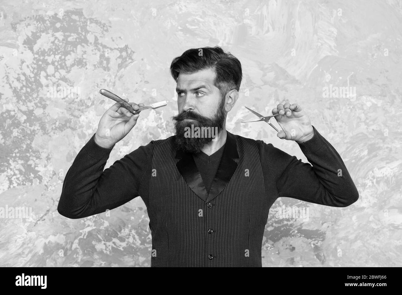 Luxury service. brutal barbershop master. bearded barber hold hairdressing tools. create new hairstyle. Barbershop retro equipments of hair cut. blade and scissors. serious man with long facial hair Stock Photo - Alamy Luxury service. brutal barbershop master. bearded barber hold hairdressing tools. create new hairstyle. Barbershop retro equipments of hair cut. blade and scissors. serious man with long facial hair Stock Photo - Alamy