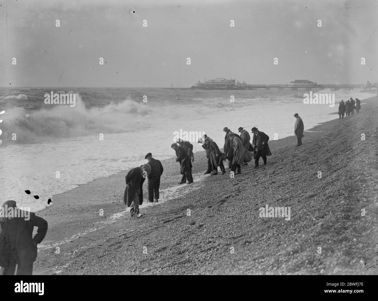 Beachcombers on Brighton beach . 10th January 1936 Stock Photo