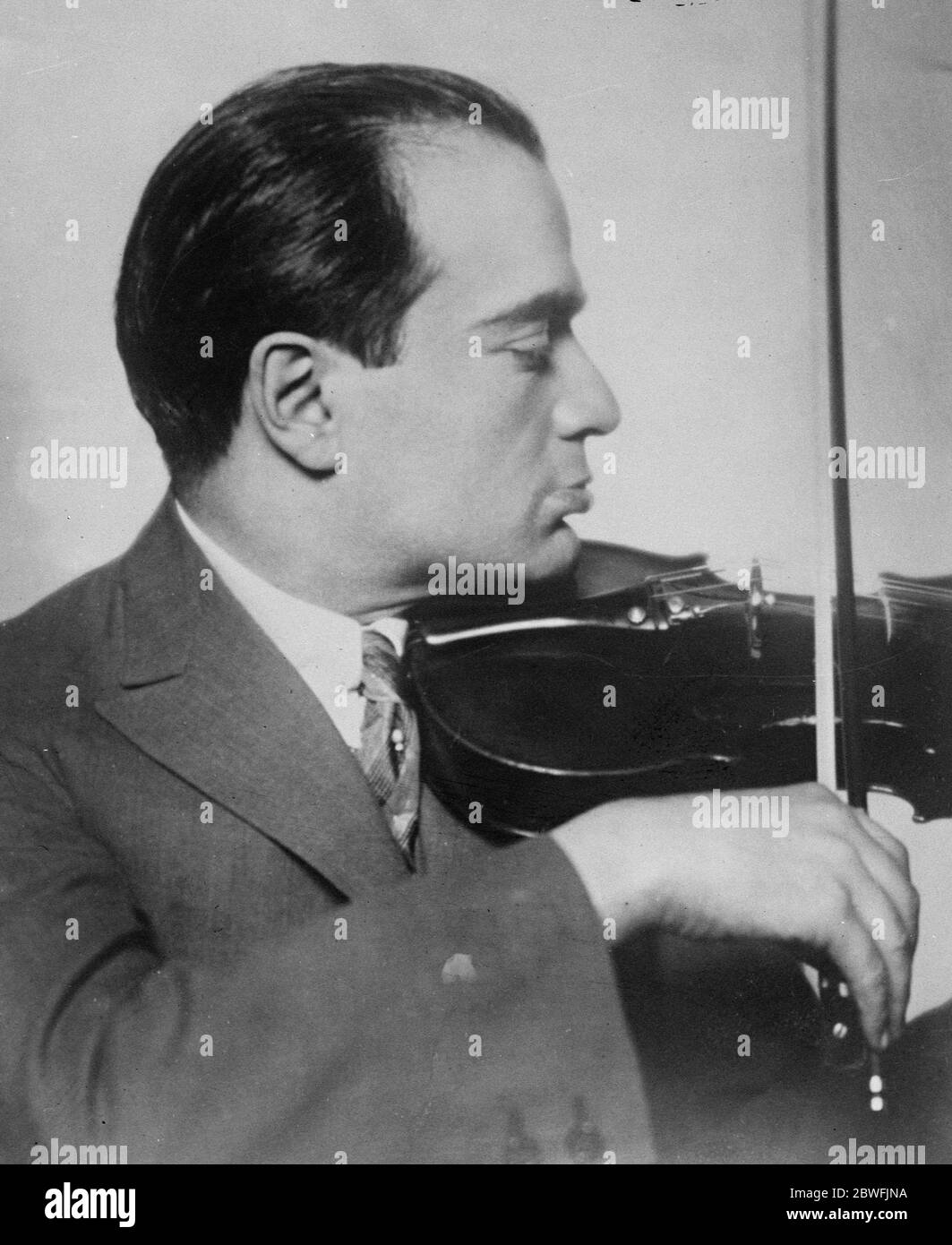 Stolen violin returned . M Bronislaw Huberman , the well known Polish violinist , whose Stradivarine , worth £20,000 was stolen from him some years ago in a Vienna Hotel . He had the instrument returned to him in a registered parcel with a polite note to the effect that as the thief had found it was unsaleable he had pleasure in returning it to its lawful owner . 18 August 1924 Stock Photo
