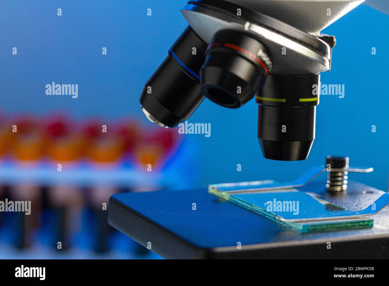 Close up photo of a microscope lenses examining glass sample Stock Photo Alamy