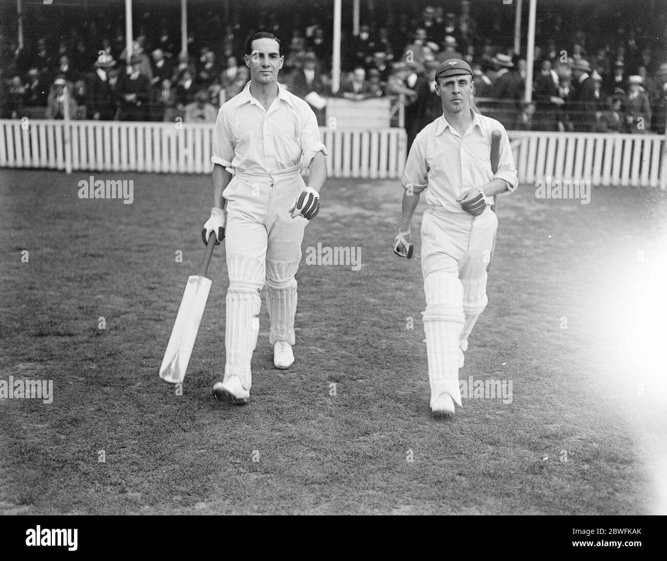 Record crowd watches . Great stand for Yorkshire . Sutcliffe and Oldroyd going out to bat . 21 August 1922 Stock Photo