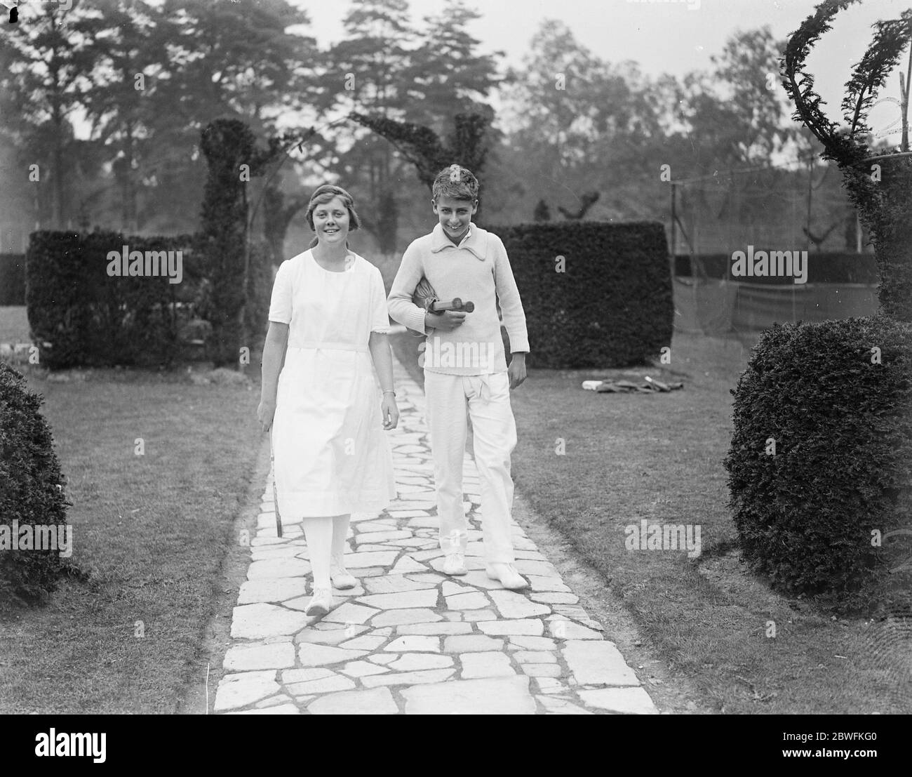 Winning smiles . H W Austin and Miss C R Sterry with the victory smile at Weybridge . 8 September 1922 Stock Photo
