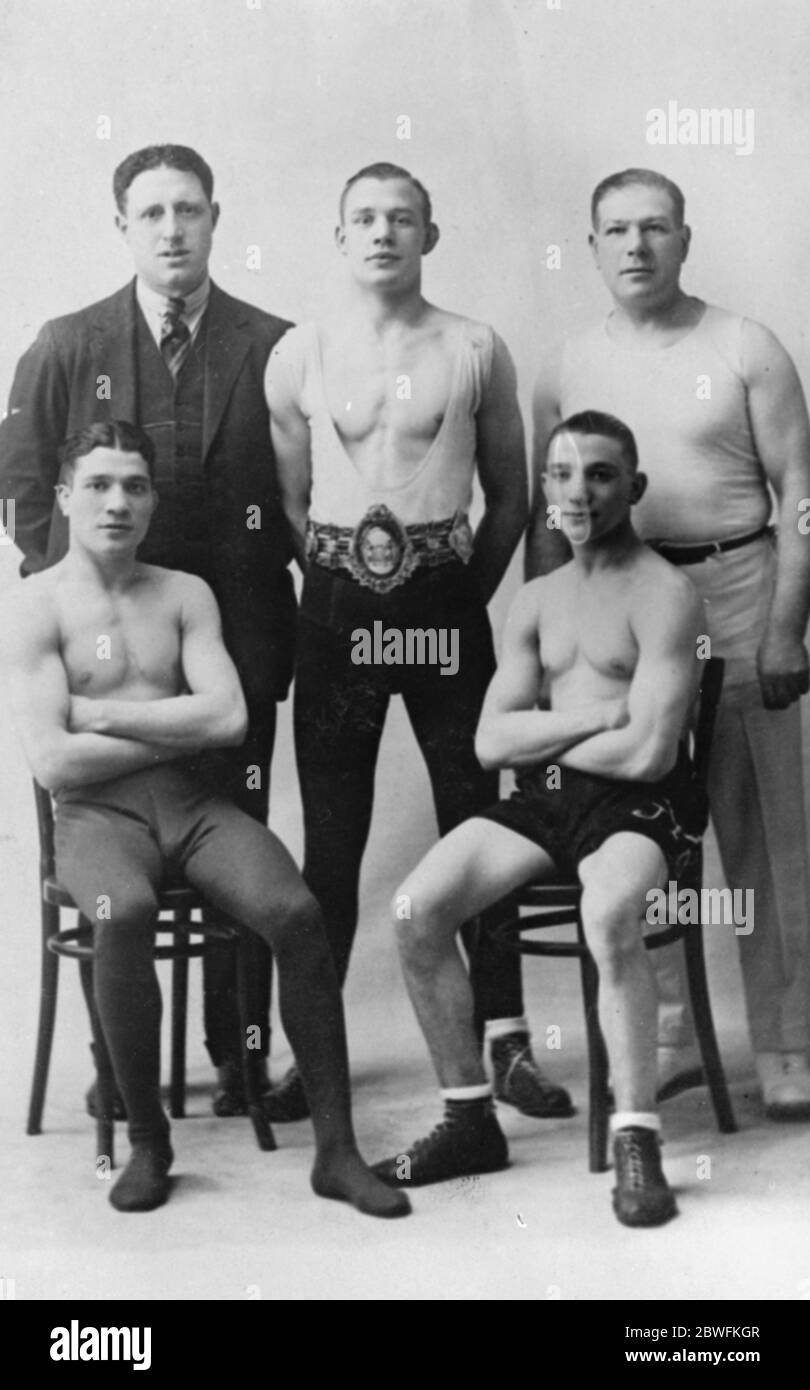 Boxers. Back row , centre ; Ernie Izzard , Jack Goodwin , trainer . Front row ; Johnny Brown , Young Johnny Brown . 1925 Stock Photo