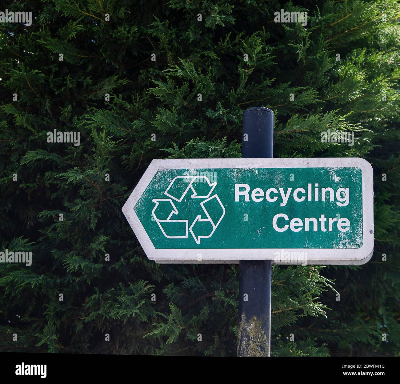 Waste recycling sign pointing to recycling centre Stock Photo Alamy