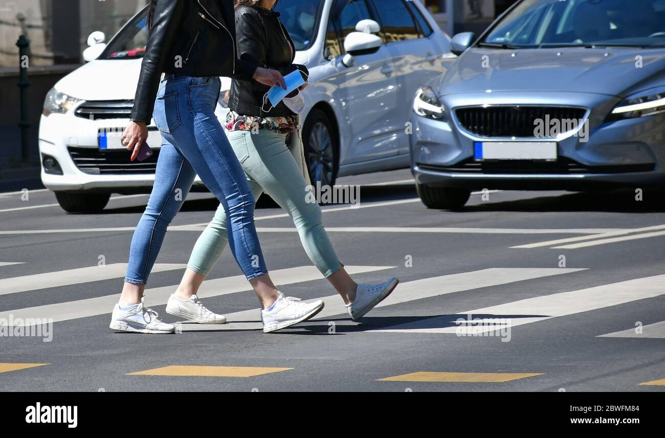 Women are walking on the pedestrian crossing Stock Photo - Alamy