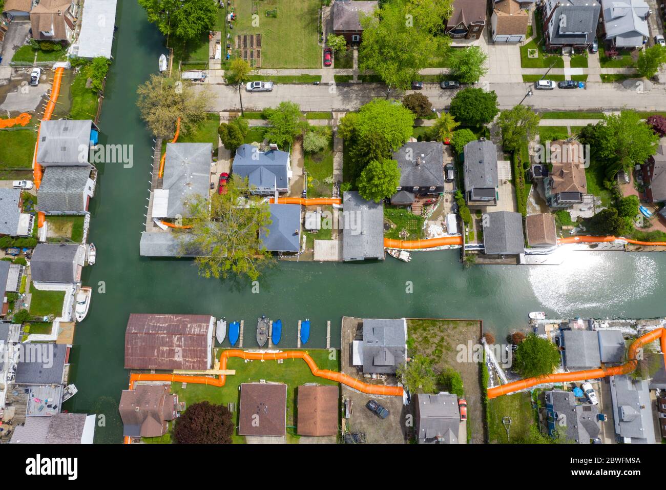 Detroit, Michigan - The city has installed orange flood control barriers around the canals on the city's east side to protect homes from flooding expe Stock Photo