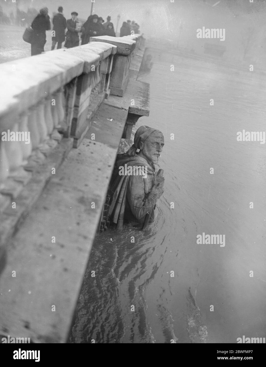 Paris under water . The famous Zouave on the Pont d'Alsace . Day by day the Seine rises higher on the figure . 4 January 1924 Stock Photo