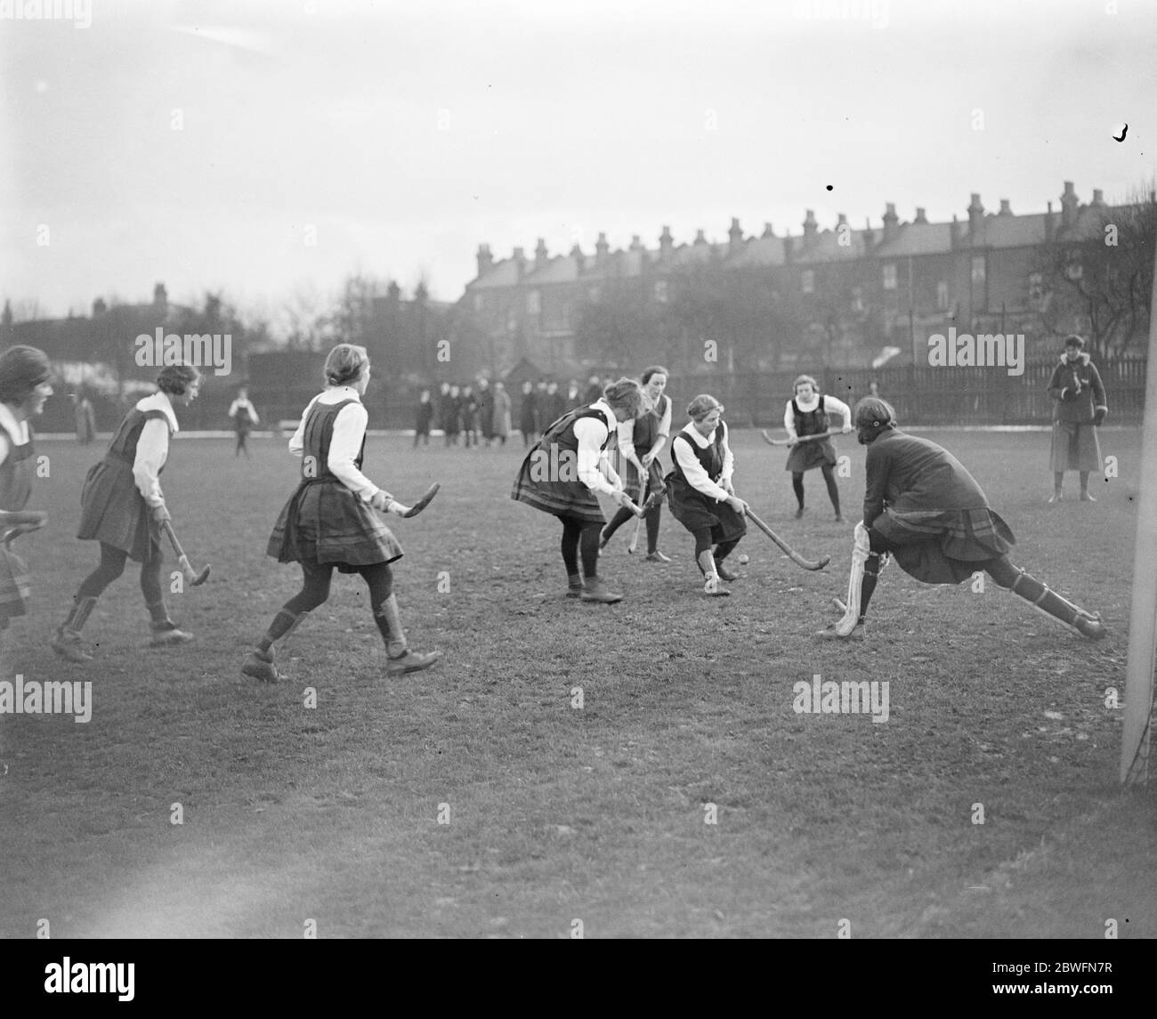 Ladies Hockey at Edmonton The King ' s College hockey team met the London School of Medicine at Edmonton in the semi final of the Inter College CupThe King ' s College goalie runs out and saves 16 February 1924 Stock Photo