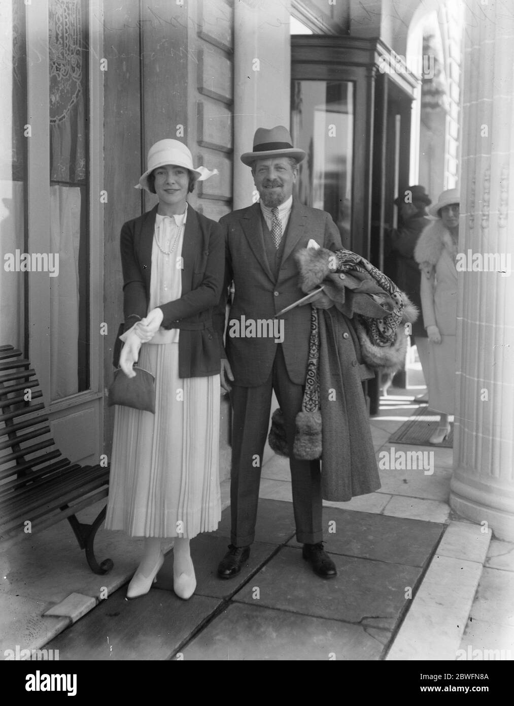 Popular stage star at Cannes Mrs Raymond Pollak with her husband at Cannes . She was formerly Miss Lily St John , the actress 19 February 1924 Stock Photo