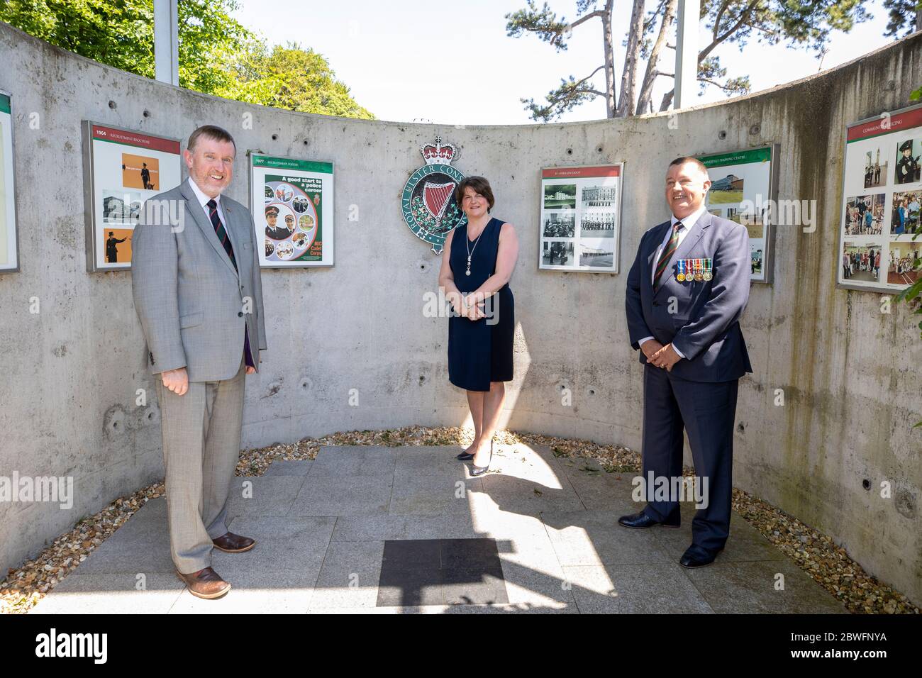 (left to right) DUP MLA and Policing Board member Mervyn Storey, DUP leader Arlene Foster and RUC Reservist Raymond Storey at the Royal Ulster Constabulary Memorial Garden at PSNI Headquarters on Knock Road in Belfast, to mark 50th anniversary of the RUC Reserve. Stock Photo