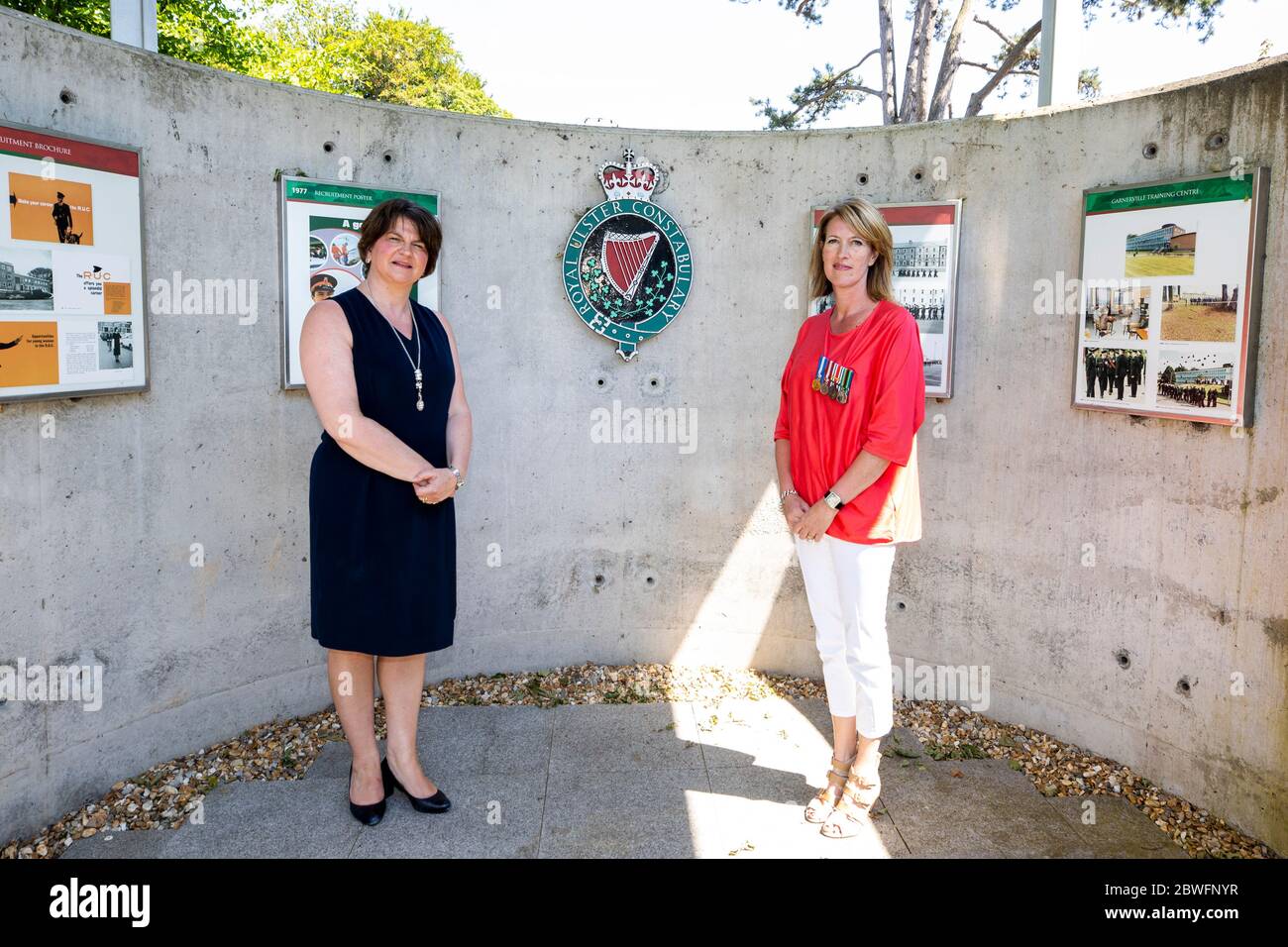 DUP leader Arlene Foster (left) with part time RUC Reservist Caroline McMullan at the Royal Ulster Constabulary Memorial Garden at PSNI Headquarters on Knock Road in Belfast, to mark 50th anniversary of the RUC Reserve. Stock Photo