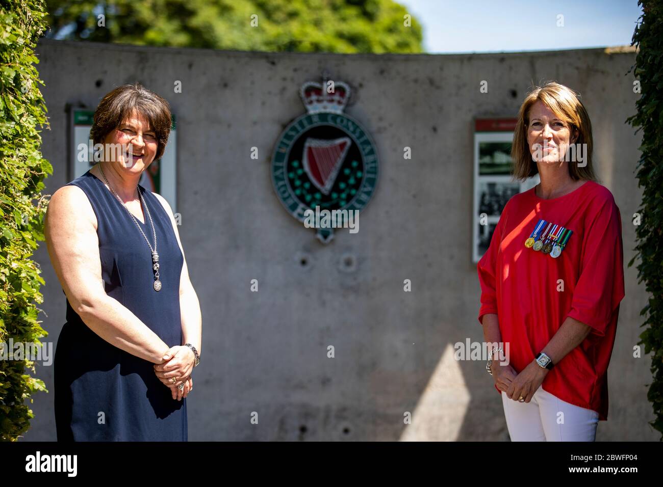 DUP leader Arlene Foster (left) with part time RUC Reservist Caroline McMullan at the Royal Ulster Constabulary Memorial Garden at PSNI Headquarters on Knock Road in Belfast, to mark 50th anniversary of the RUC Reserve. Stock Photo