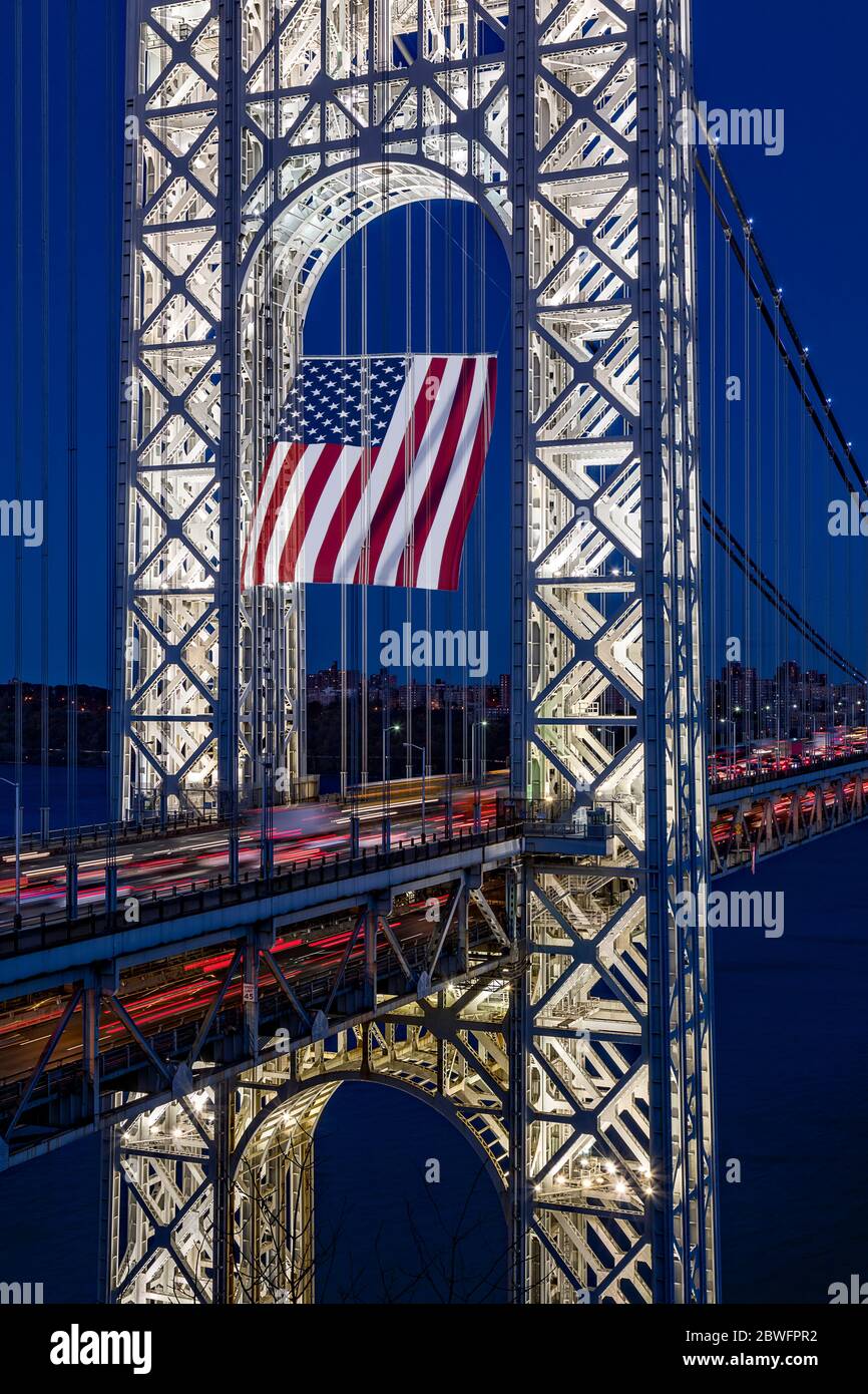 George Washington Bridge GWB with the worlds largest free flying American flag Stock Photo