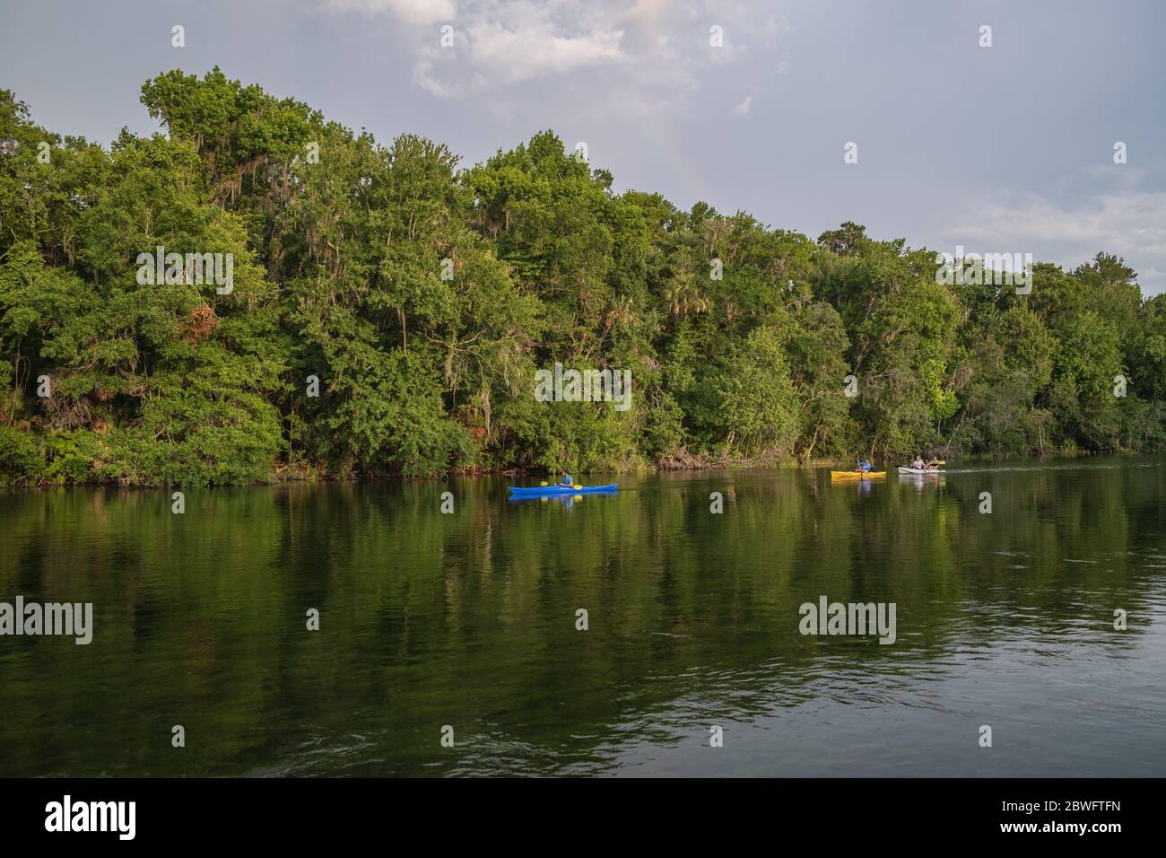 Boating on the clear waters of the spring fed scenic Rainbow River. Dunnellon, Florida. A popular tourist destination in North Central Florida. Dunnel Stock Photo