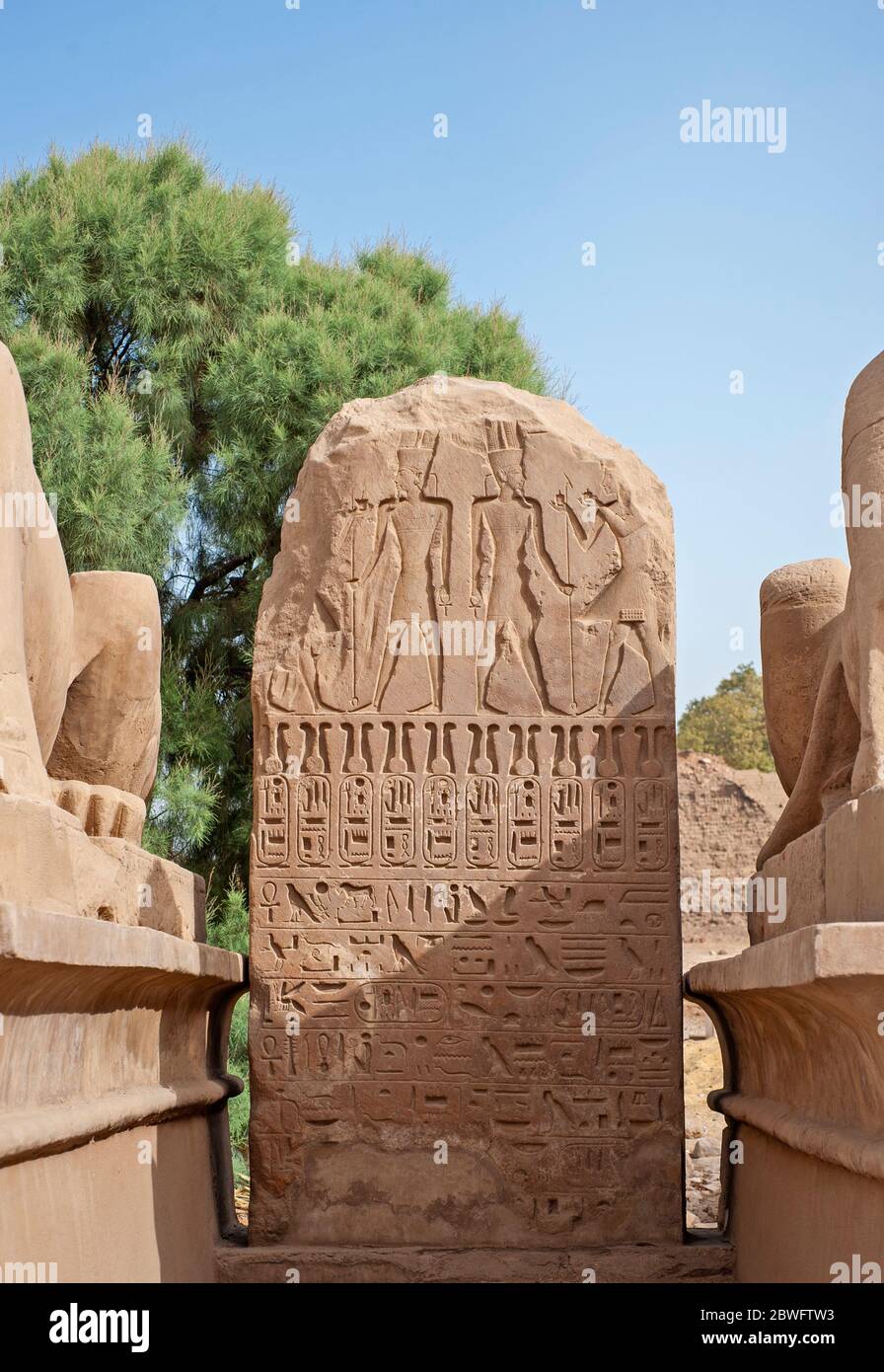 Hieroglypic carving on stone tablet wall at the ancient egyptian Karnak temple in Luxor Stock Photo