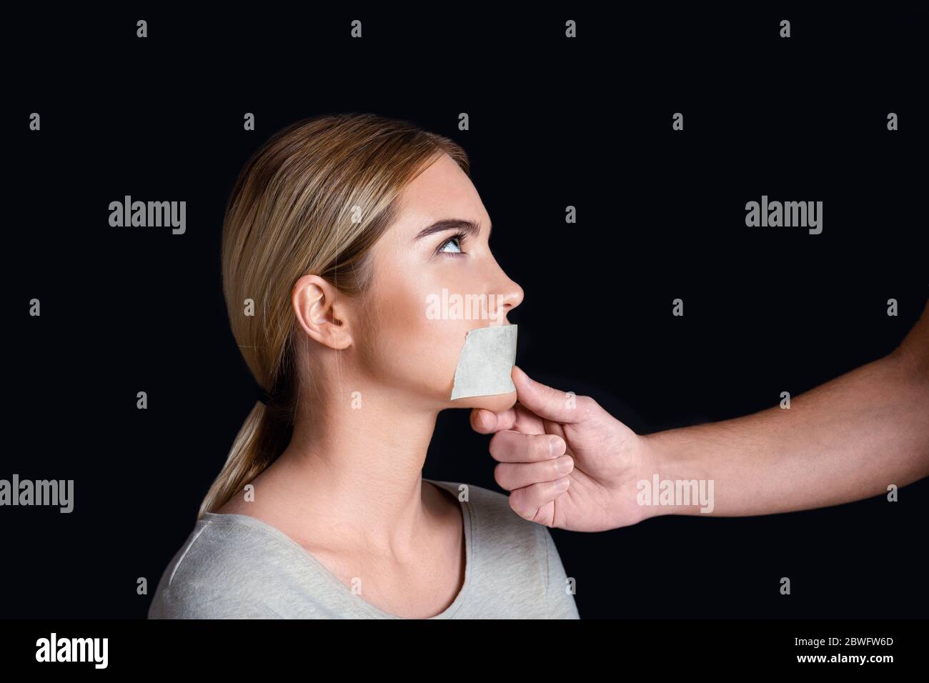 Tape over mouth hi-res stock photography and images - Page 2 - Alamy
