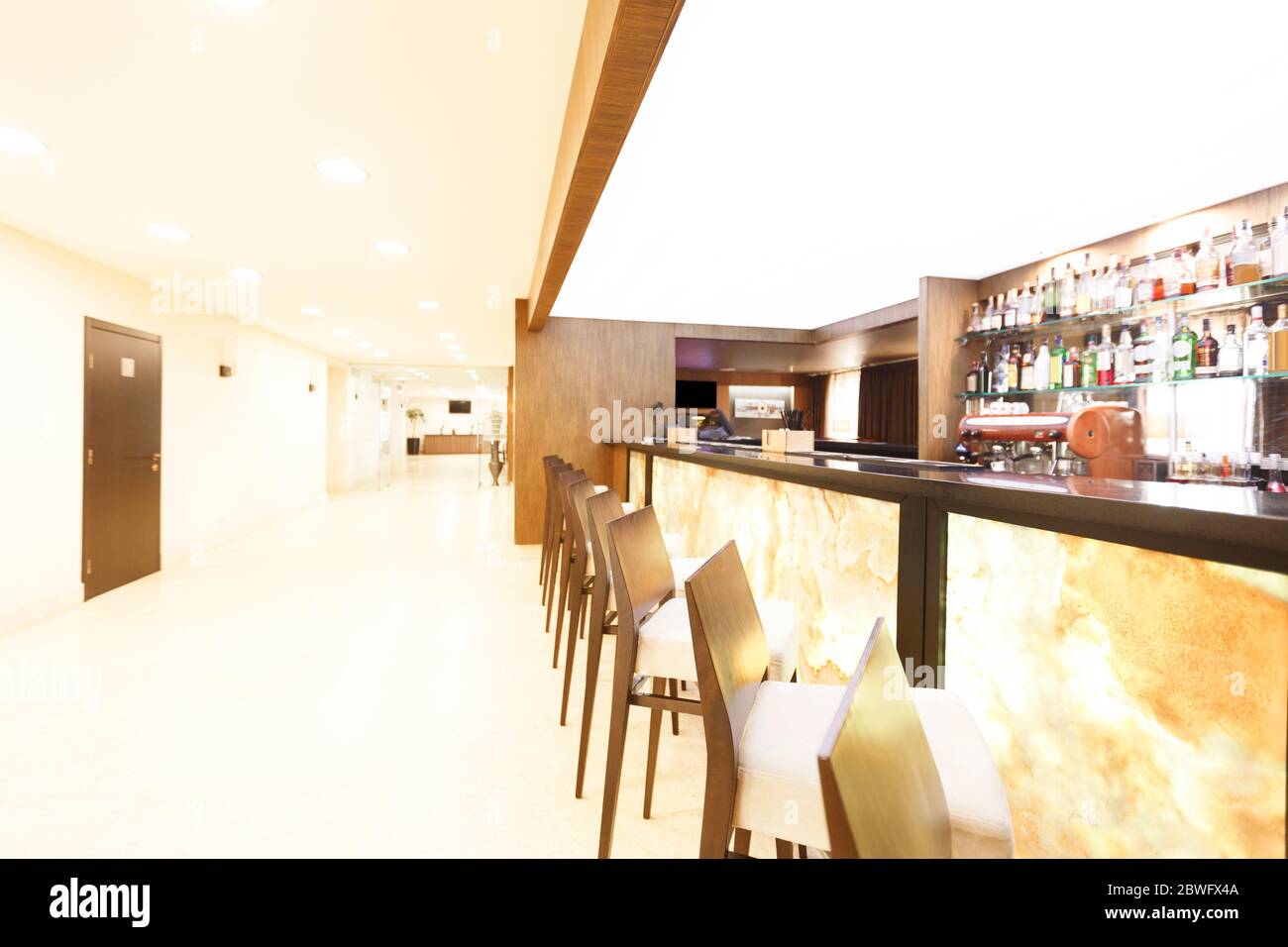 Brightly lit by lamps, bar at hotel Stock Photo