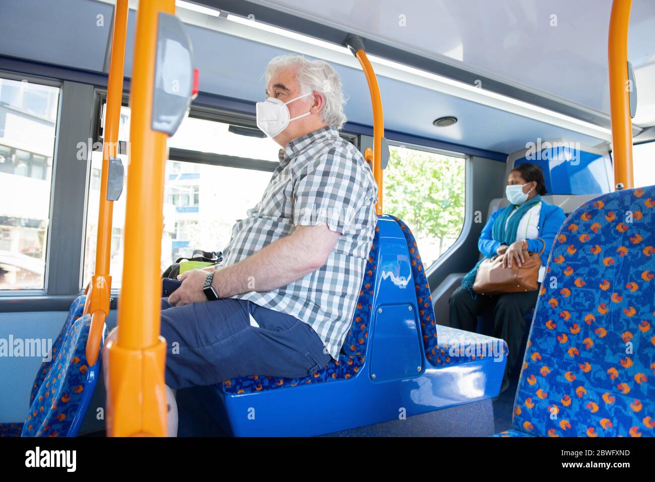 New stickers on buses remind commuters to socially distance during the COVID-19 pandemic.  Double decker bus route 53, Old Kent Road.  May 30, 2020. Stock Photo
