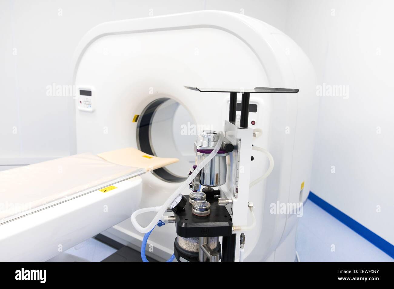 Closeup of empty Magnetic Resonance Imaging Machine / MRI Scanner in modern veterinary clinic. View of CT (Computed tomography) in hospital. Medical e Stock Photo