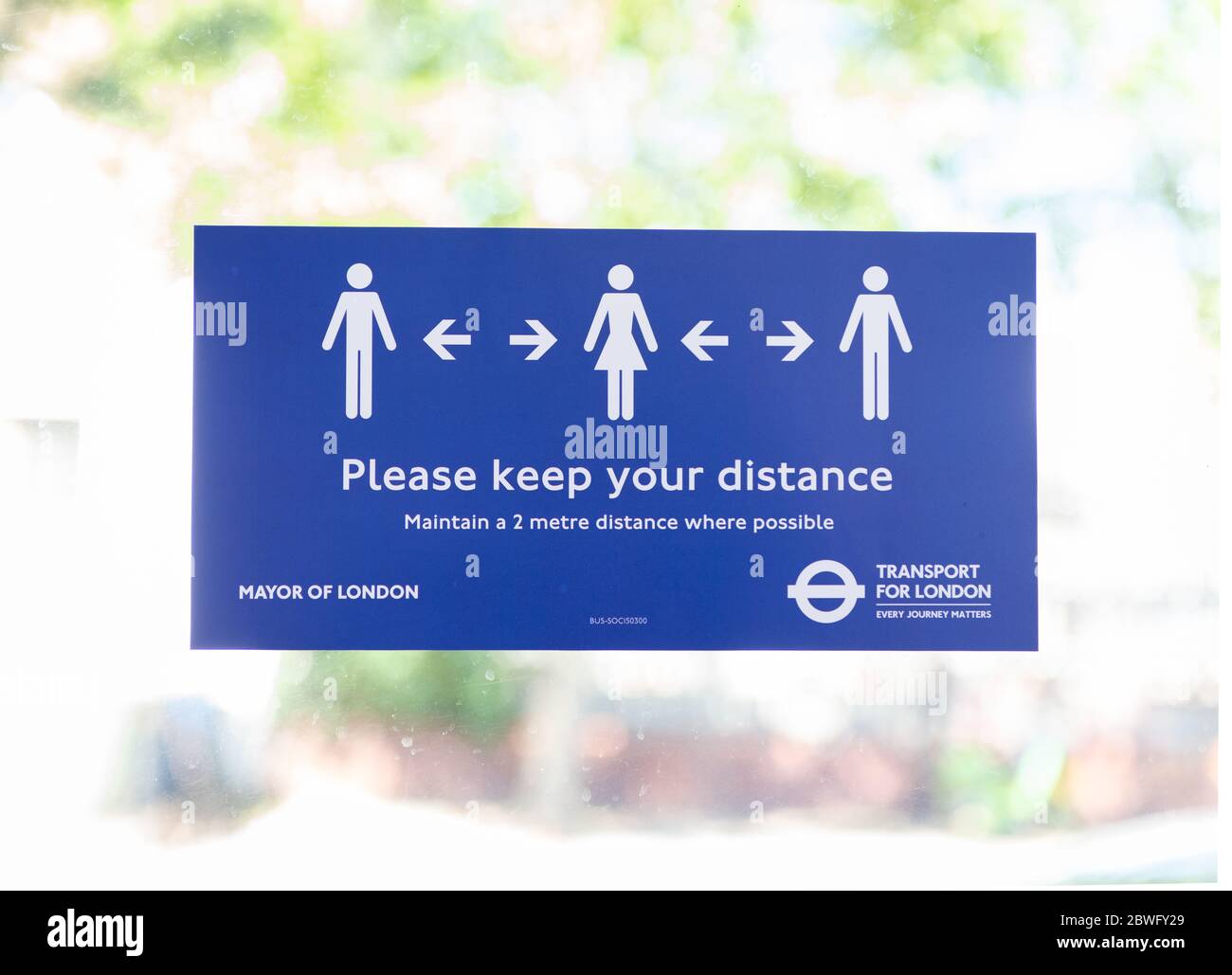 New stickers on buses remind commuters to socially distance during the COVID-19 pandemic.  Social distancing sign.  May 30, 2020. Stock Photo