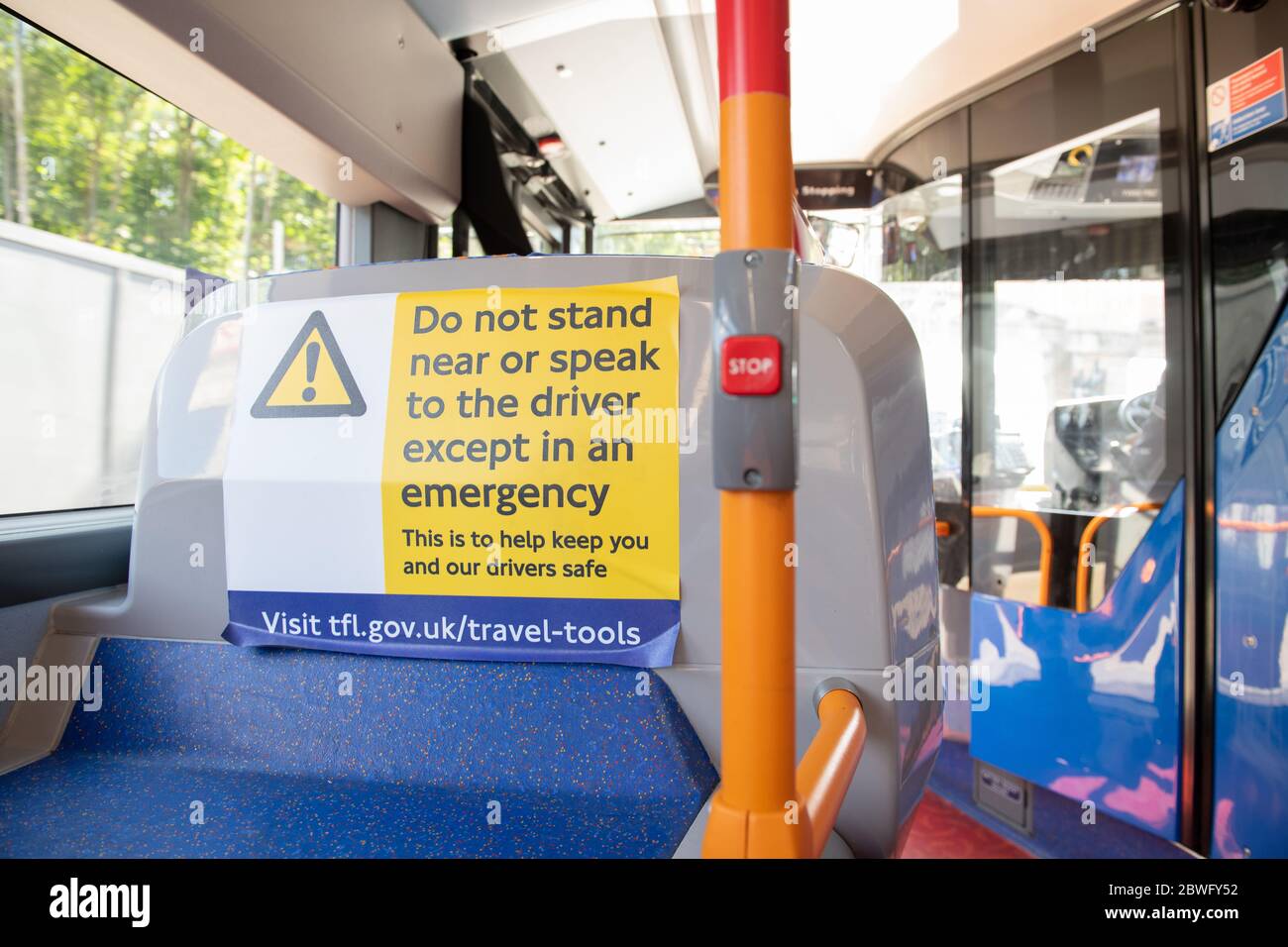 New stickers on buses remind commuters to socially distance during the COVID-19 pandemic.  Bus route  53. May 30, 2020. Stock Photo