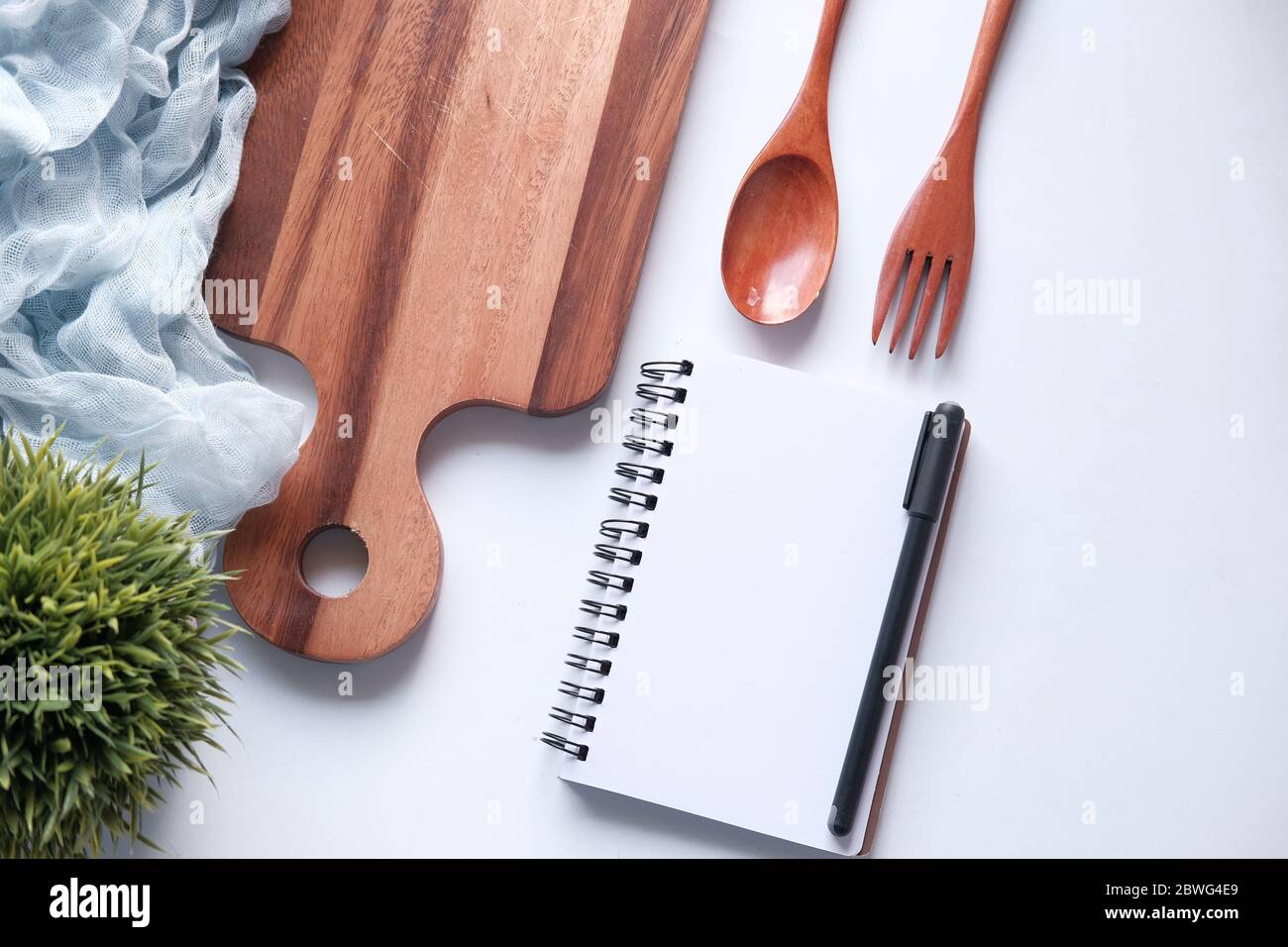 diet plan concept with notepad and chopping board on white background  Stock Photo