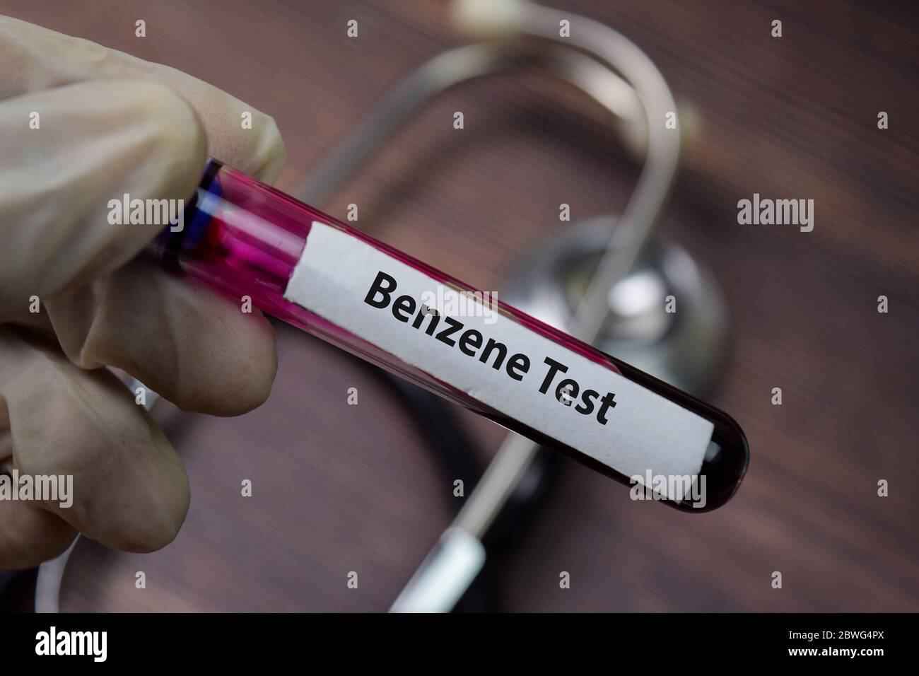 Benzene Test text with blood sample. Top view isolated on black