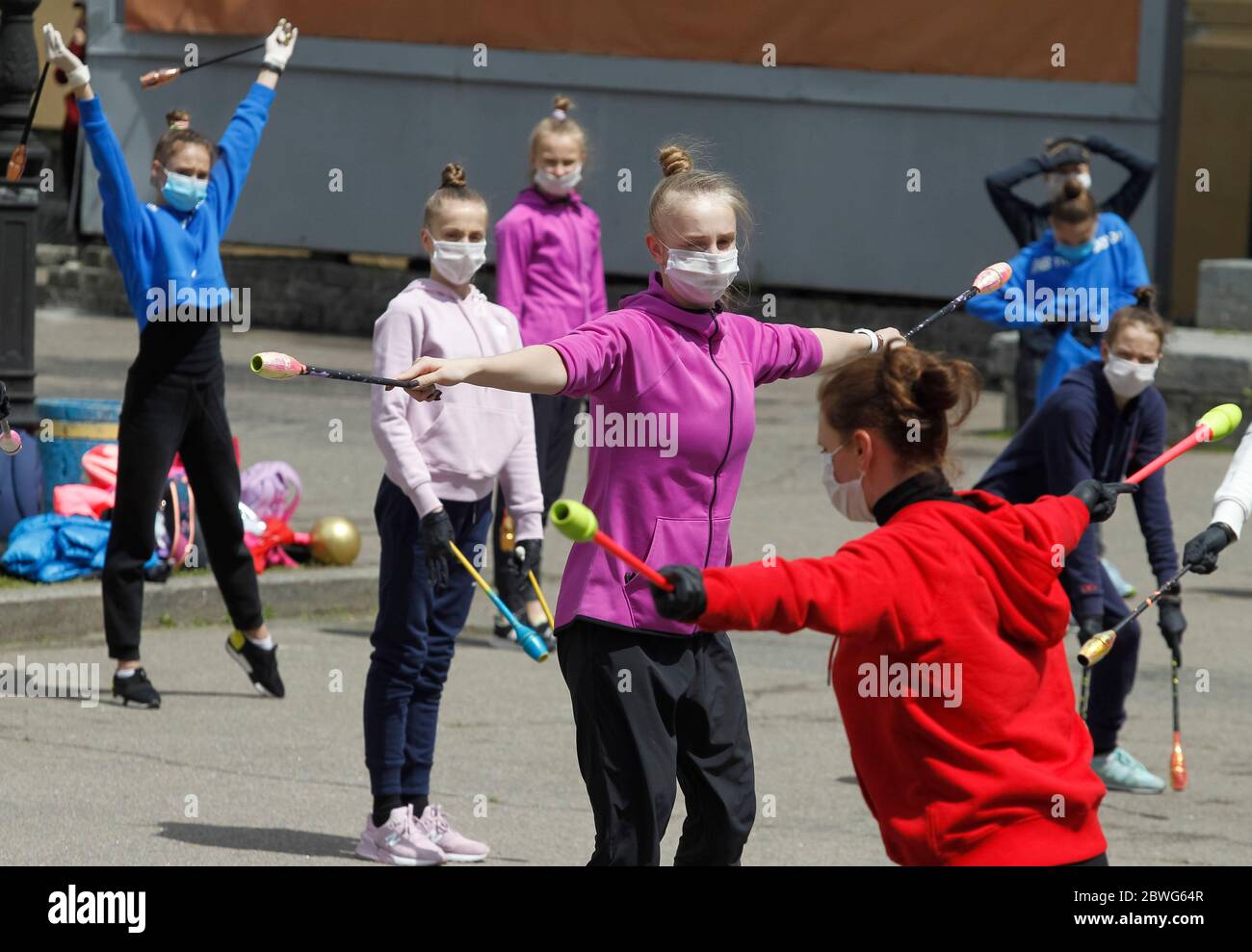 Gymnasts wearing face masks as a preventive measure against the spread of COVID-19 coronavirus perform during an open-air training session.Young gymnasts of Ukrainian Deriugina School staged an open-air training session to raise awareness on the situation of the Deriugina School with no building for training, because the rental agreement for the club's training facility expired. The Deriugina School is known rhythmic gymnastics club by the former world champion Irina Deriugina, her coach and mom Albina Deriugina. Irina Deriugina is a former Soviet individual rhythmic gymnast from Ukraine and U Stock Photo