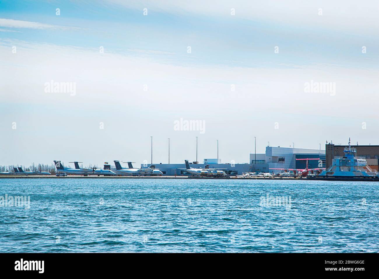 TORONTO, ONTARIO - APRIL 18, 2020: A planes are staying at Billy Bishop Toronto City Airport on April 18, 2020 in Toronto, Canada during Coronavirus p Stock Photo