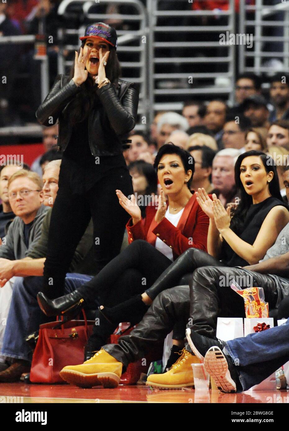 Kim Kardashian, Kanye West, Khloe Kardashian, Kris Jenner and Bruce Jenner watch the LA Clippers v Denver Nuggets NBA game at the Staples Center, Los Angeles, California. 25 December 2012 Stock Photo