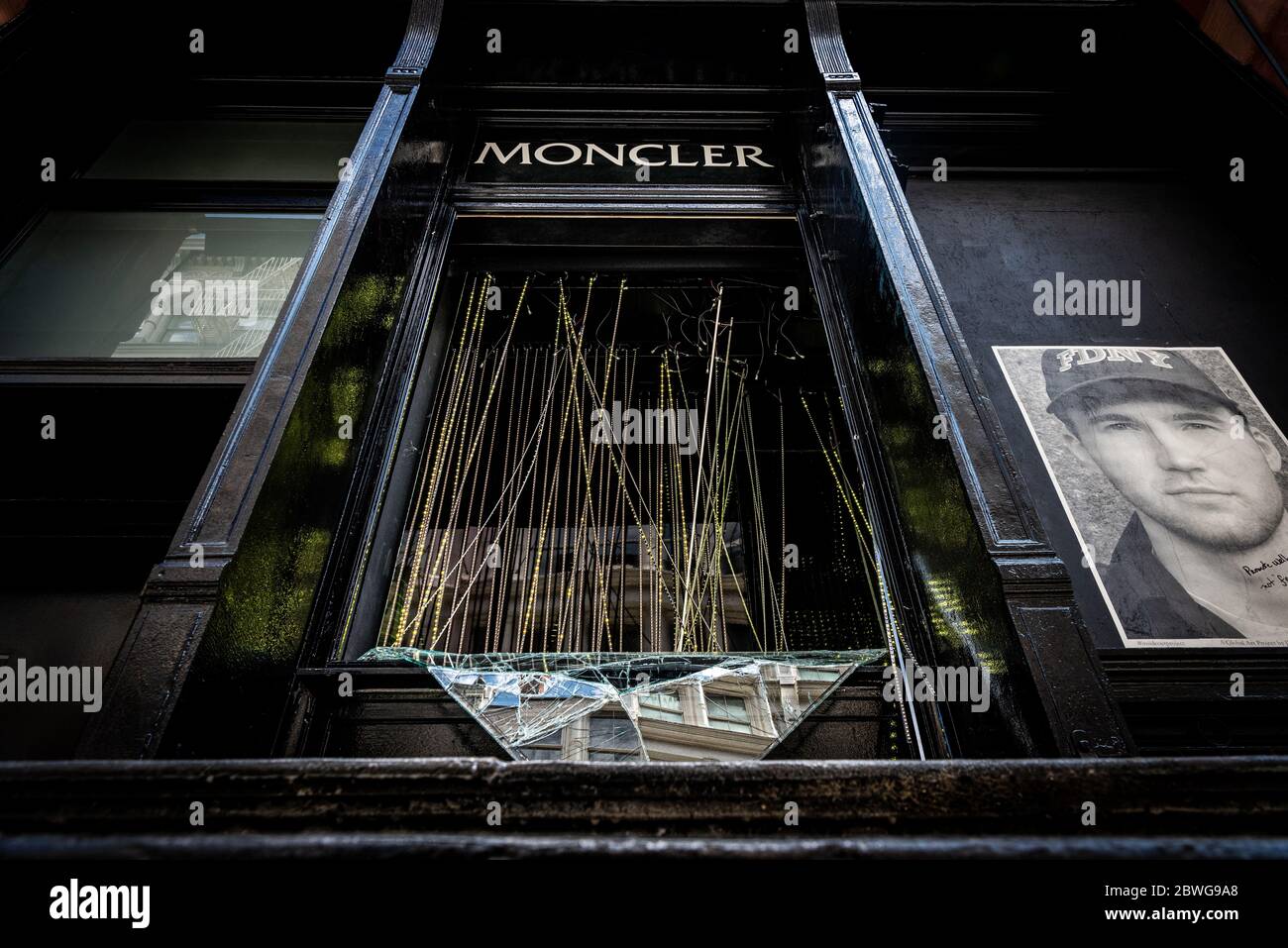 The smashed window of Moncler in Soho, New York on June 1, 2020, after  violence broke out on Sunday night related to the George Floyd protests,  and rioters broke store windows and