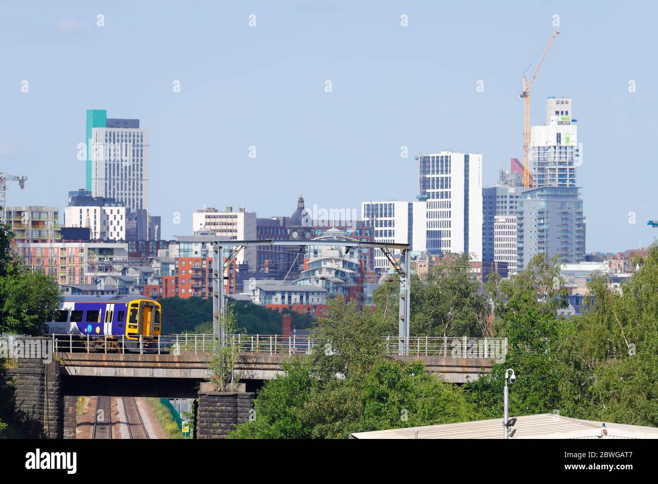 A rail class 158 operated by Northern Rail, heads out of Leeds Stock Photo